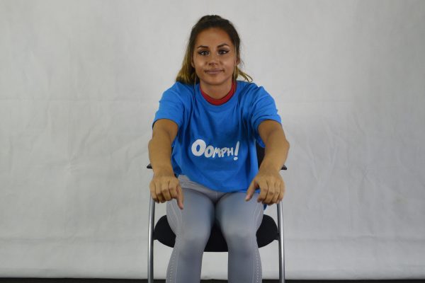 With feet firmly on the ground. Lean forward from the hips and reach both arms out. 16 times. Bring your body back to the centre and pull your arms in as if you are rowing.