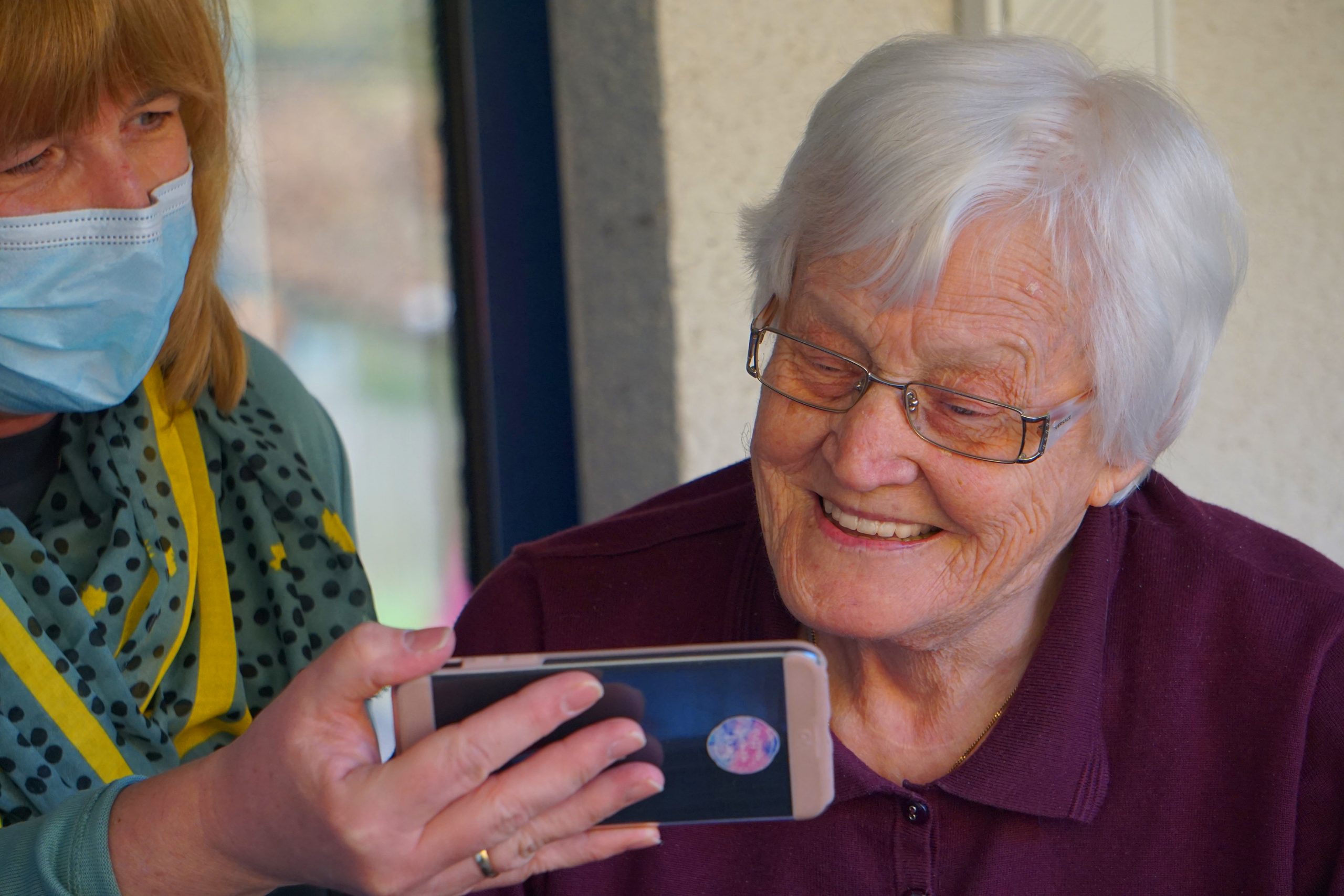 Older adult resident using device